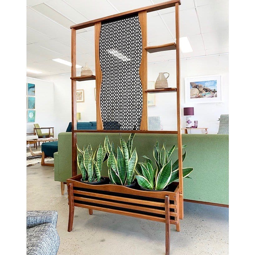 Sophisticated living room divider with built-in planters