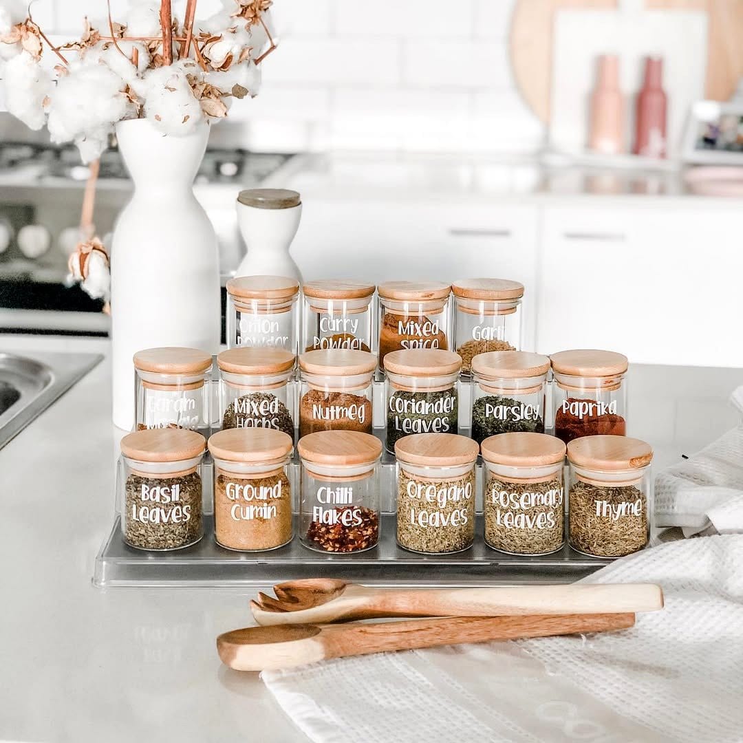 Organized open-shelf pantry with labeled jars