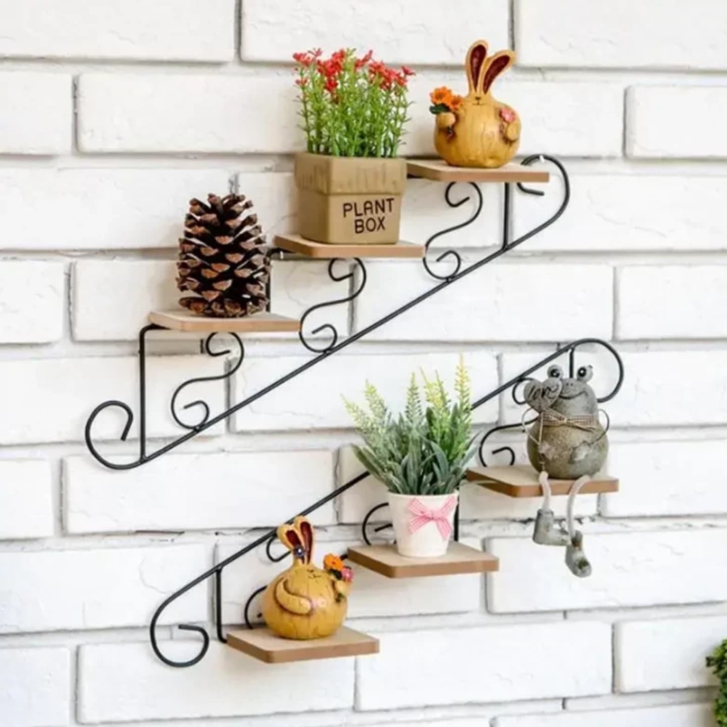floating shelves with small plants on staircase wall