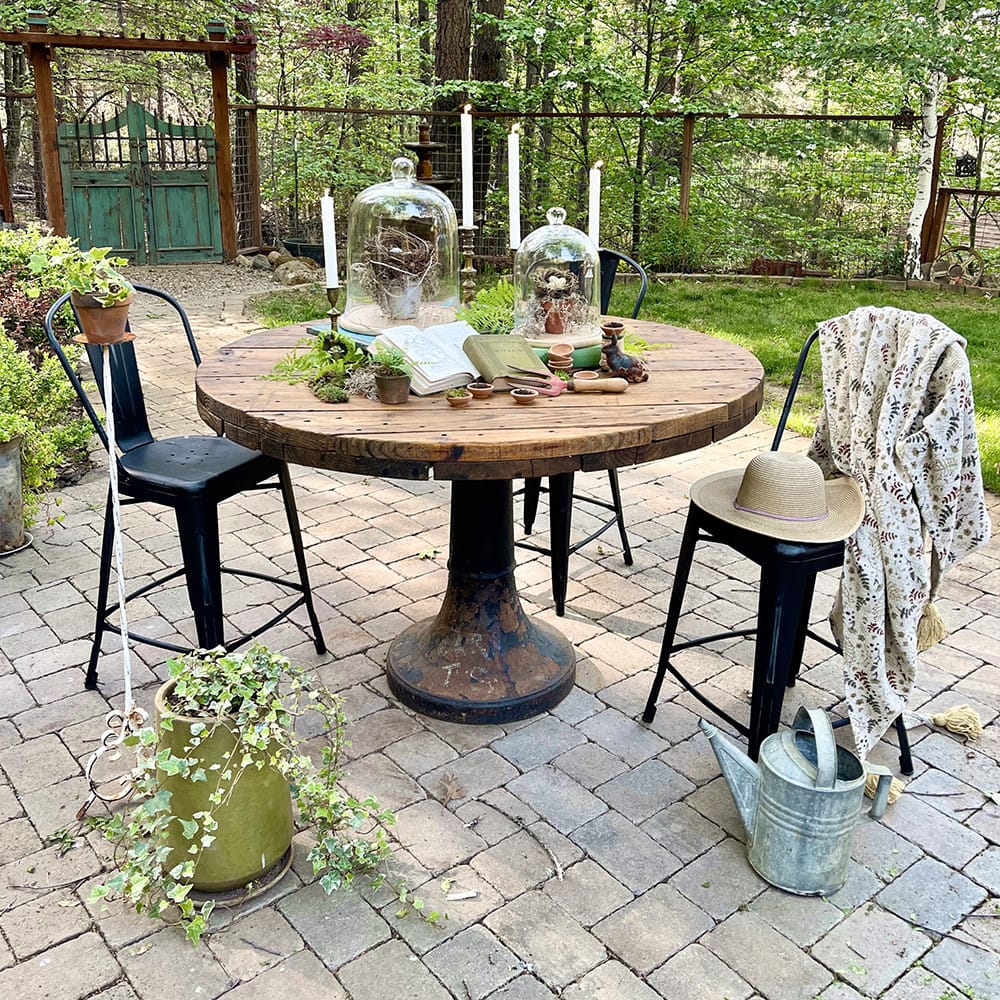 farmhouse-style cable spool table with distressed finish