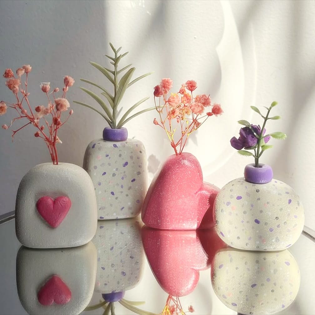 uniquely shaped plant pots with aloe vera
