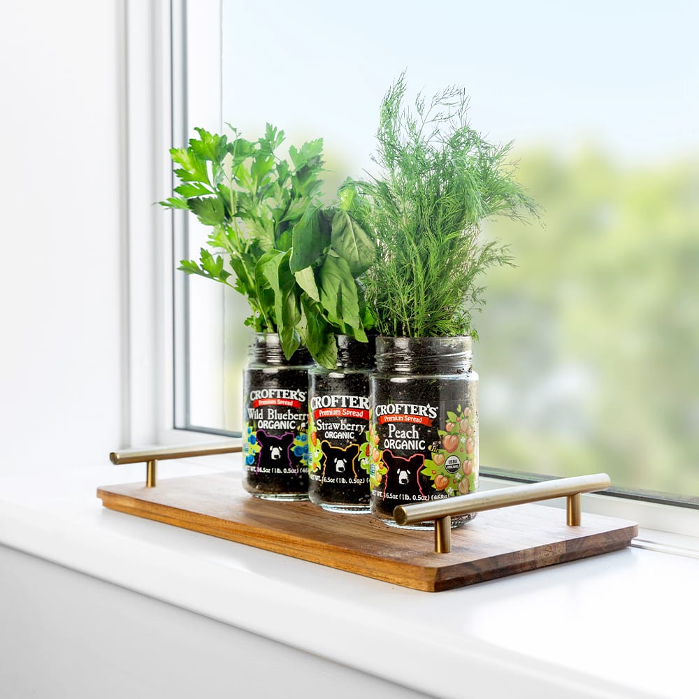 hanging herb mobile with tin cans