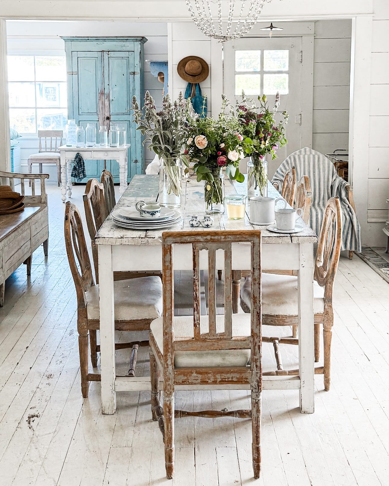 Herb-filled Mason jars on a dining table