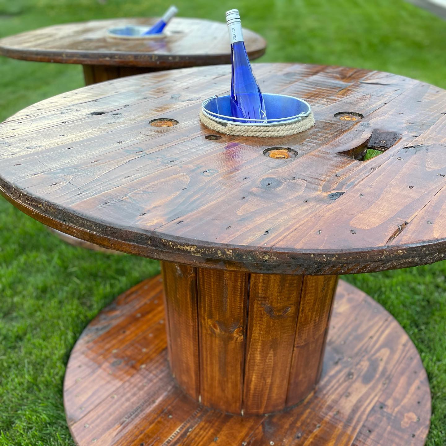 cable spool table on a patio with outdoor plants