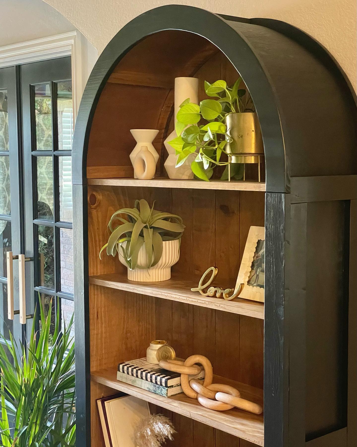 heirloom pot on rustic bookshelf