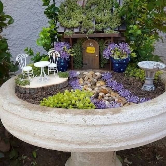 whimsical fairy garden in bathtub