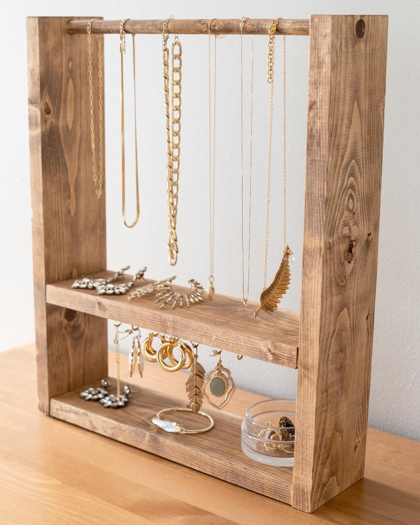 hollowed log jewelry holder with necklaces