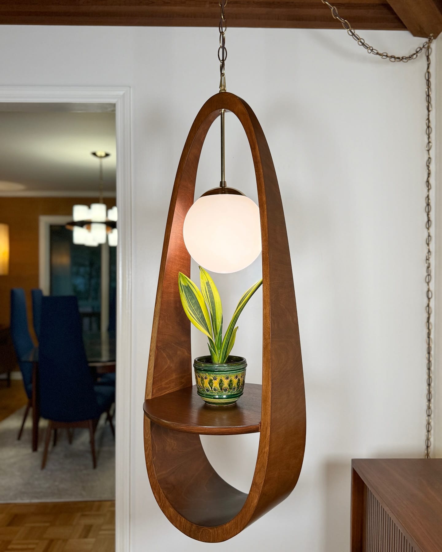 hanging light bulb planter with tiny fern
