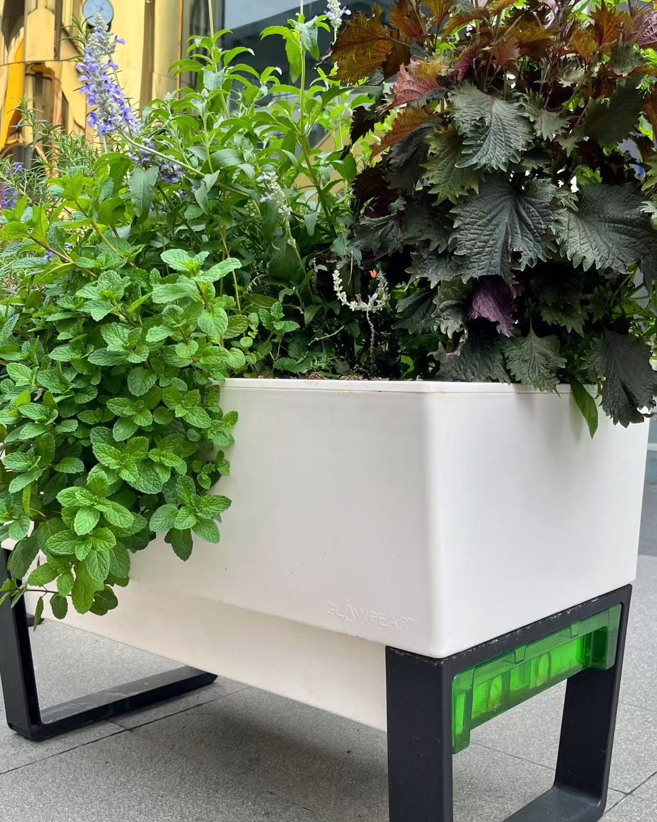 colorful stackable planters on balcony