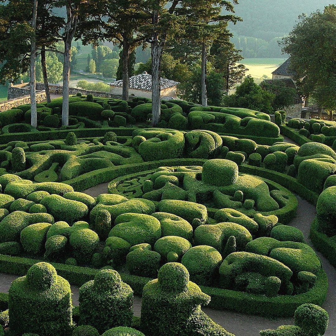 massive green sculpture in urban park