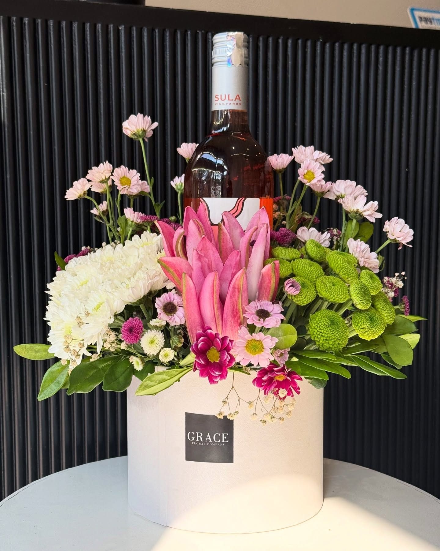 elegant wine display with wall-mounted test tubes