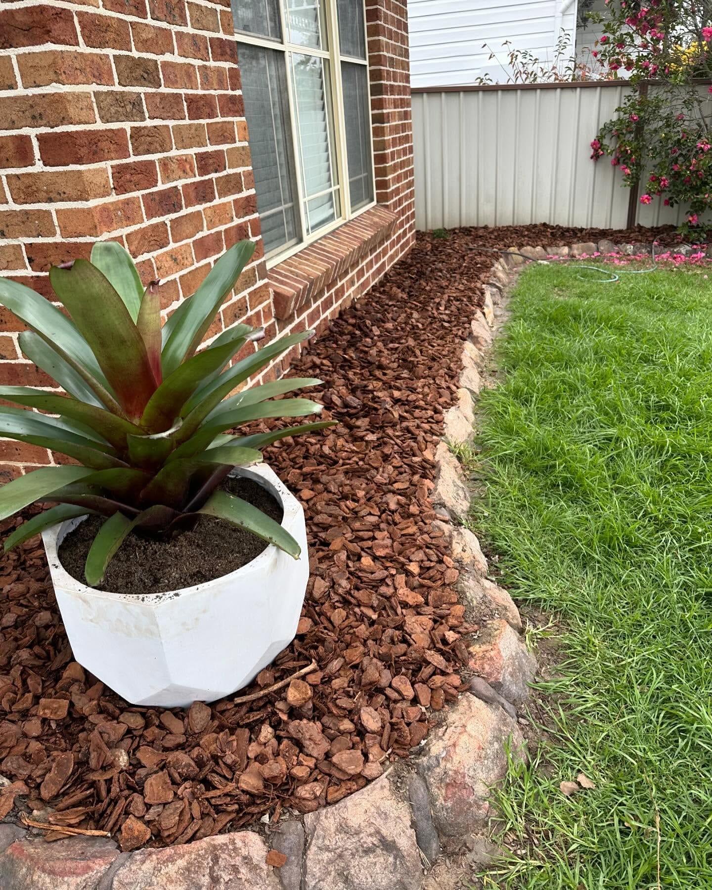 garden bed with volcanic rock mulch