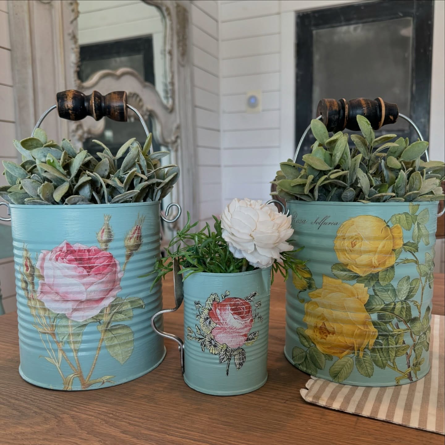 colorful tin cans on windowsill