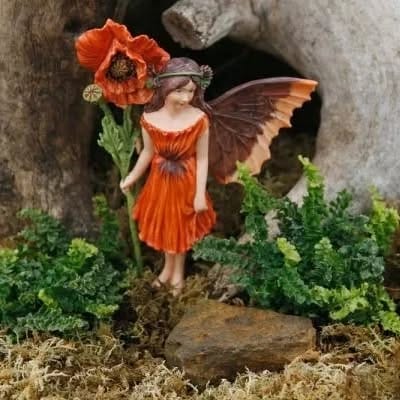 fairy garden with moss-wrapped items