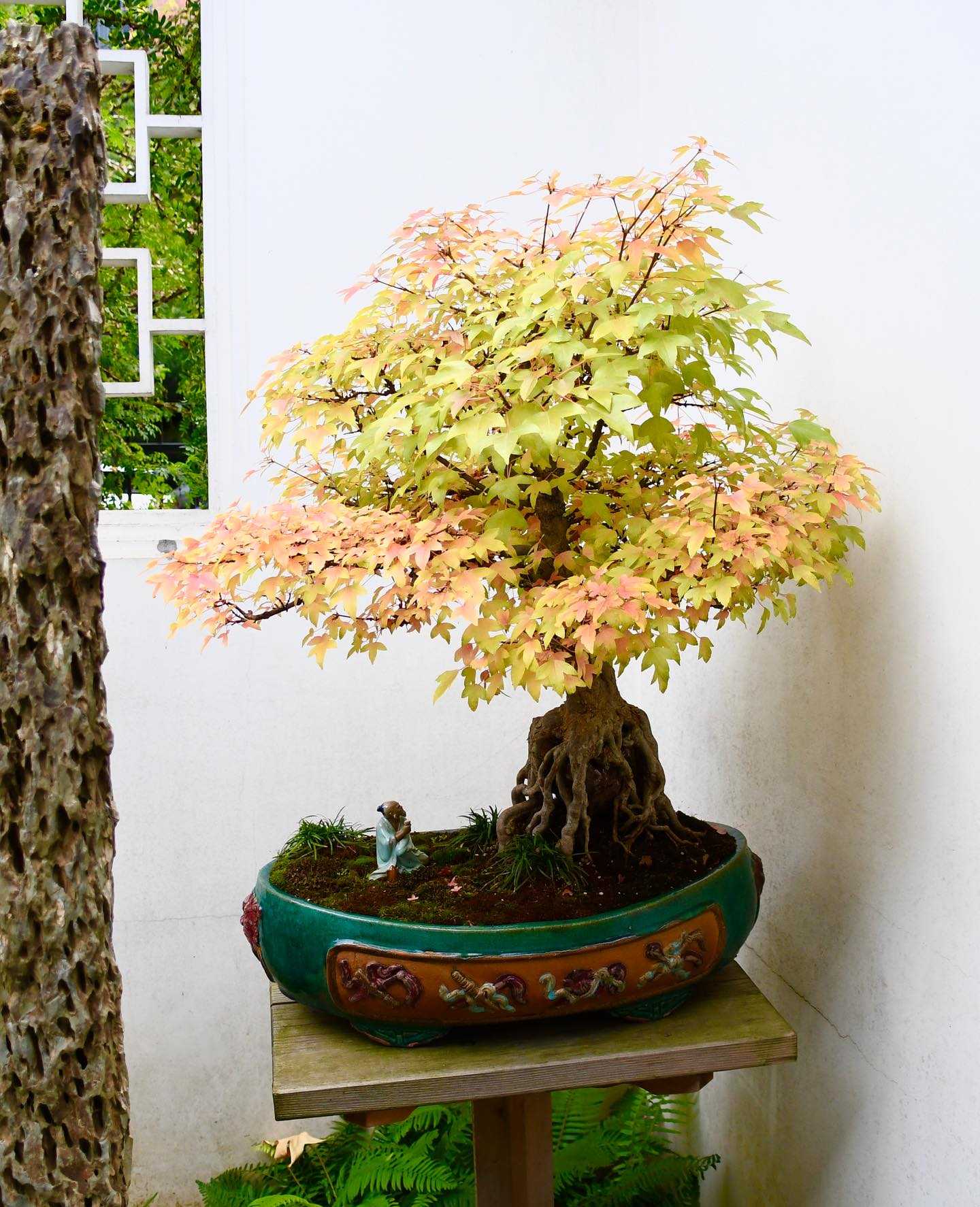 small Buddha statue among plants