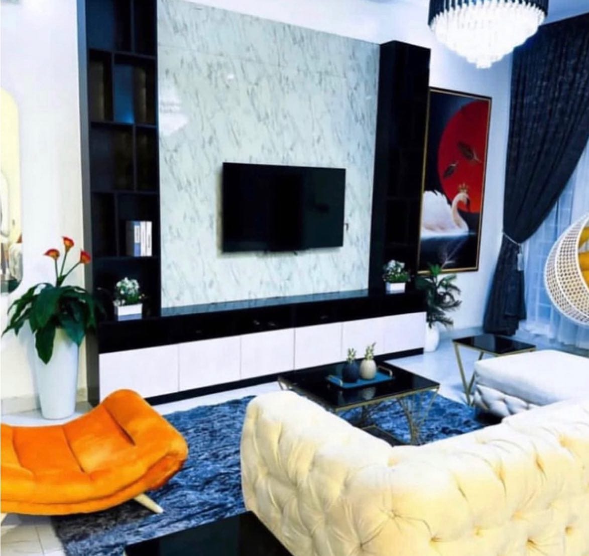 white orchids beside TV