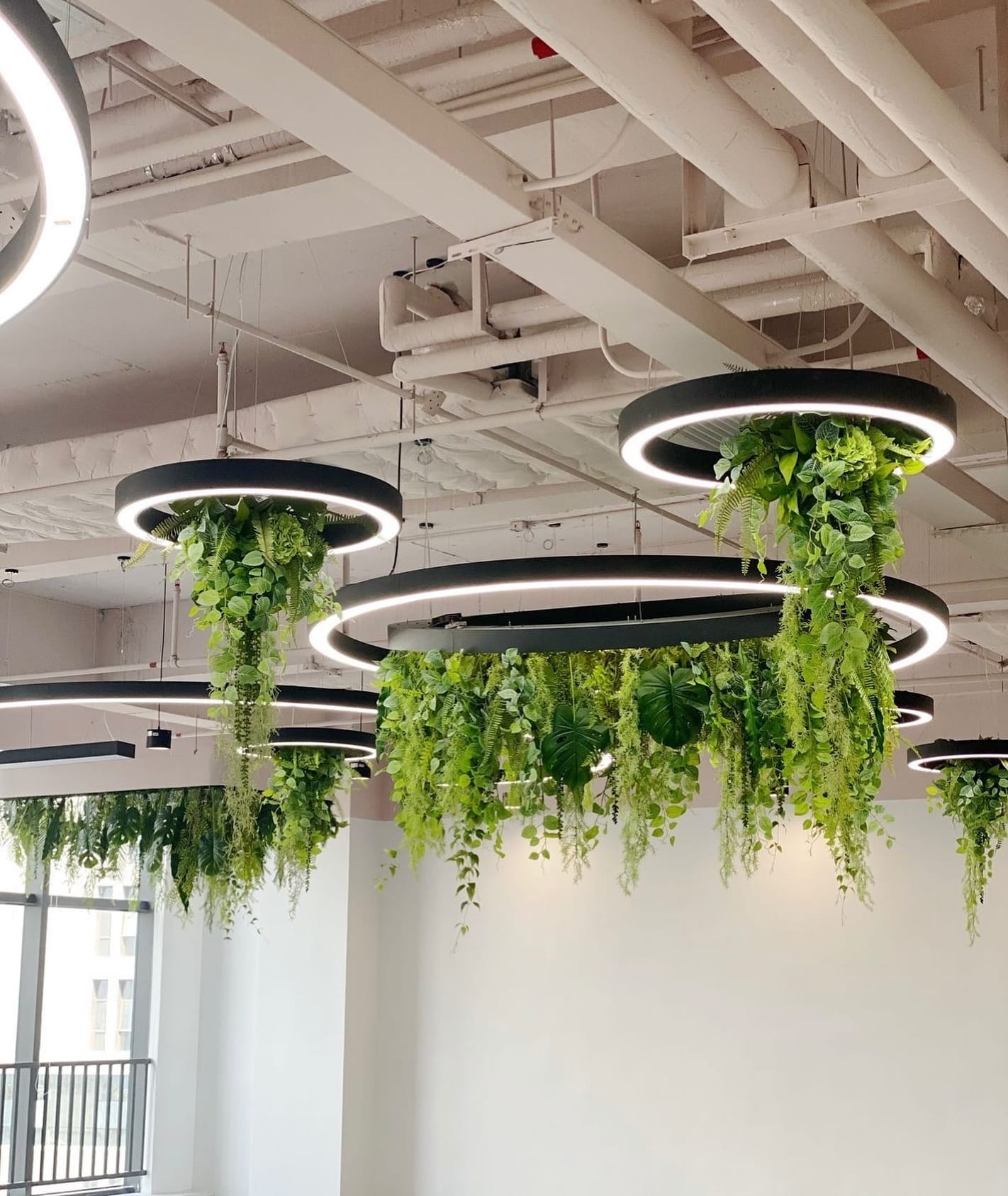 vertical plant chandelier in hallway