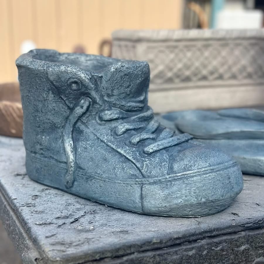 outdoor wooden shoe plant holder on patio