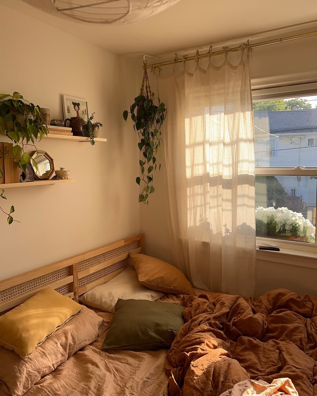 macramé plant holders on headboard