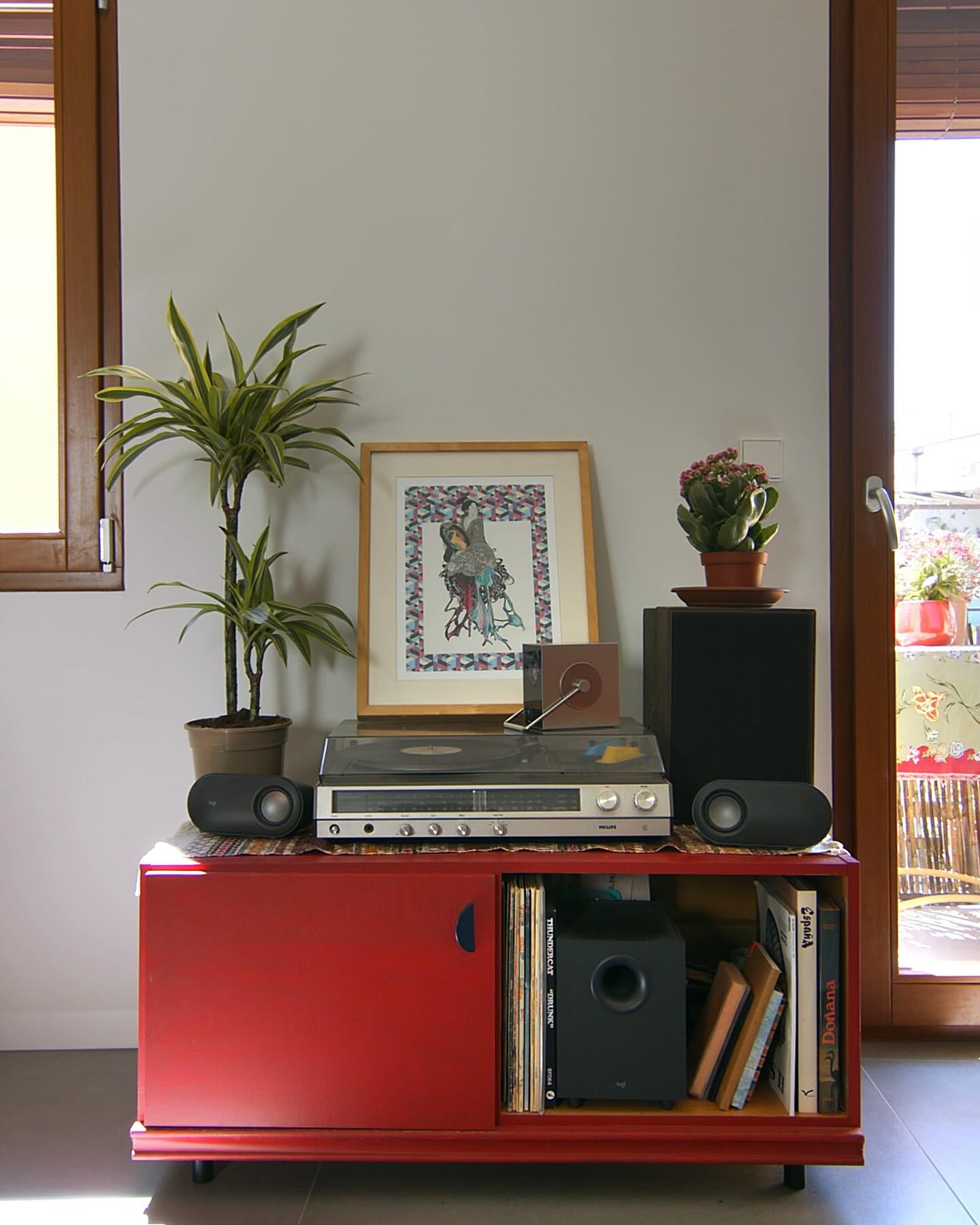 tiered plant stand with records