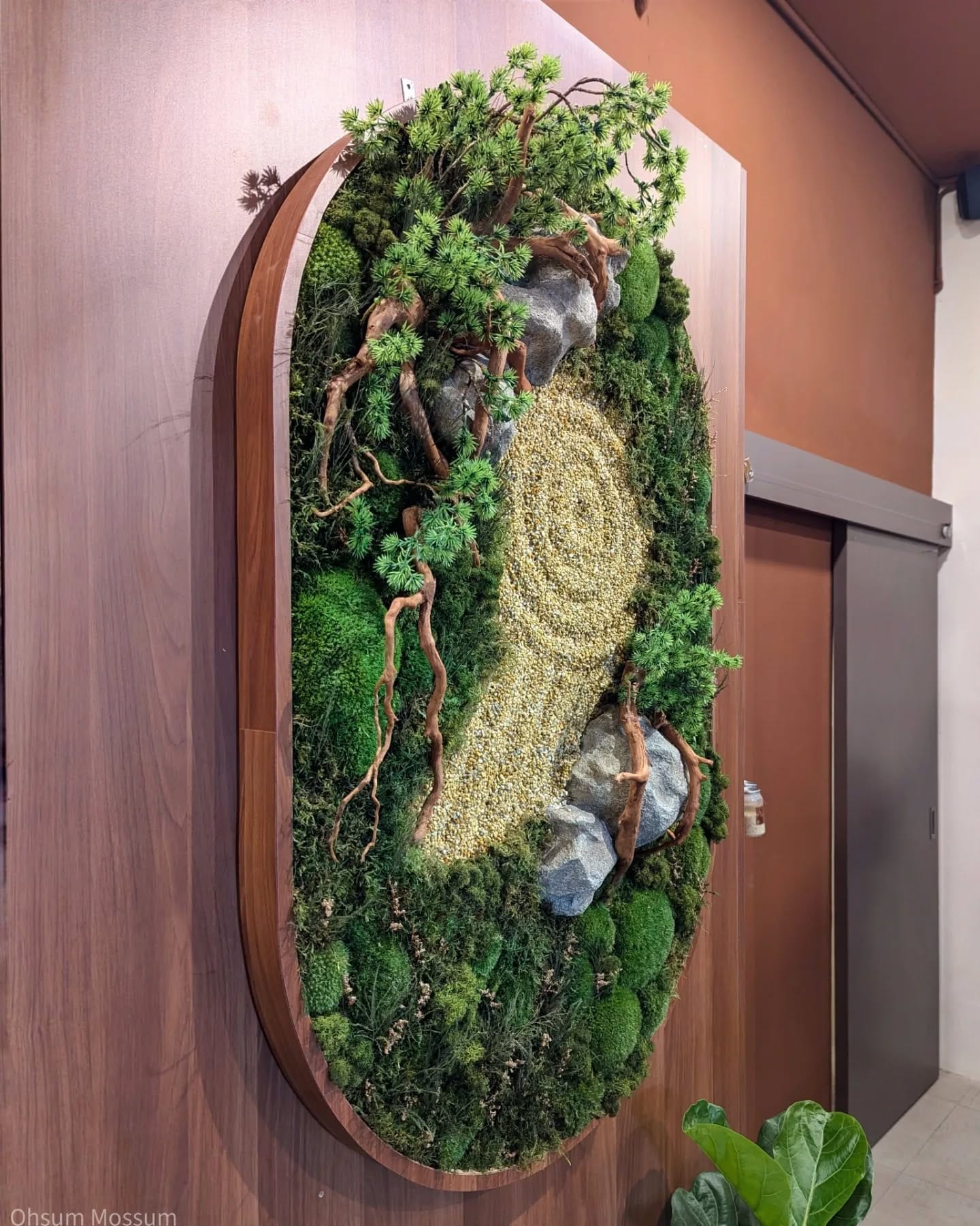 moss-wrapped plants in zen garden