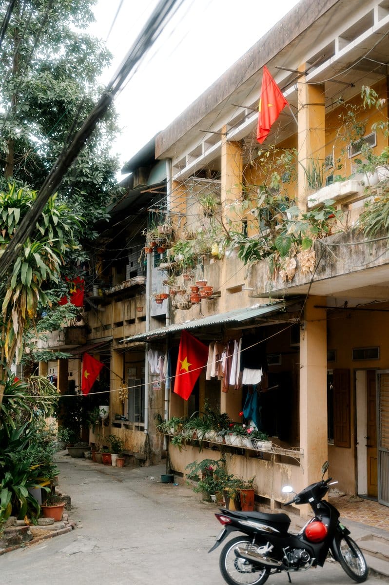 Tranquil balcony with hanging prayer flags and plants