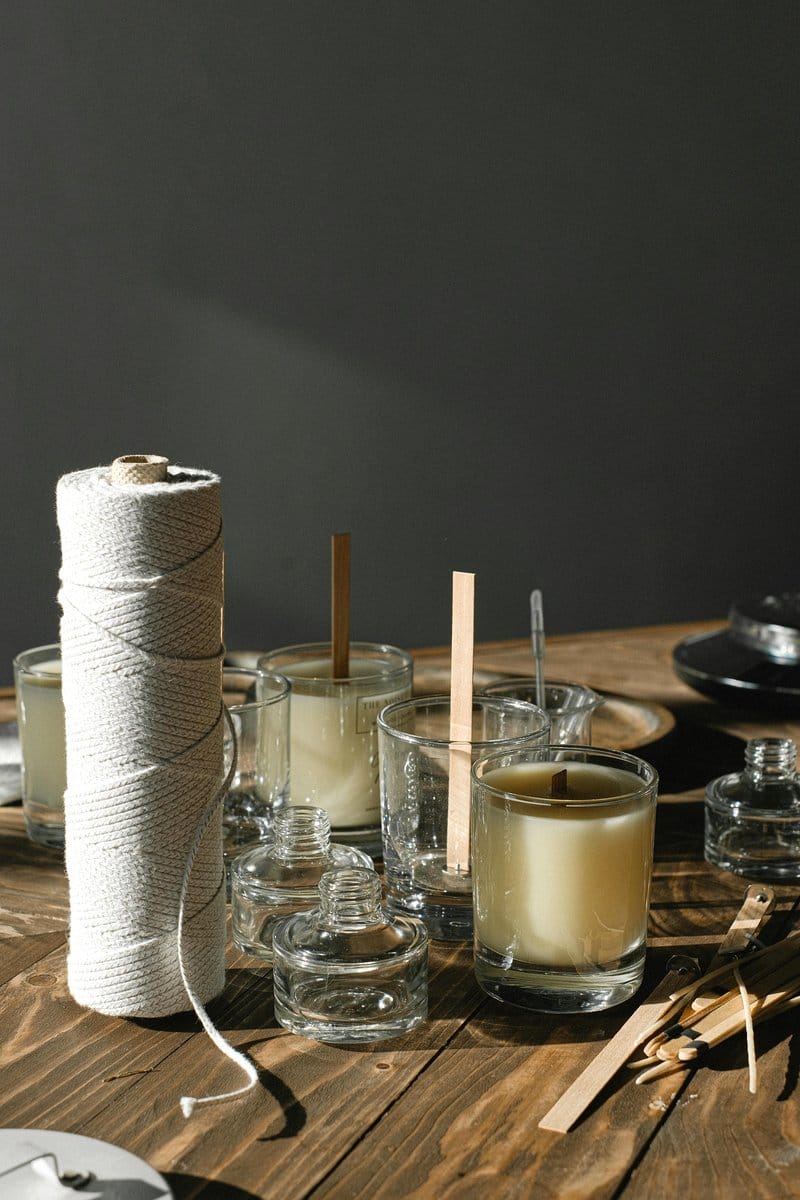 Saffron-scented candles in glass jars