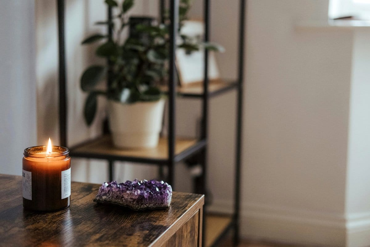 Purple-themed plant shelf with amethyst accents