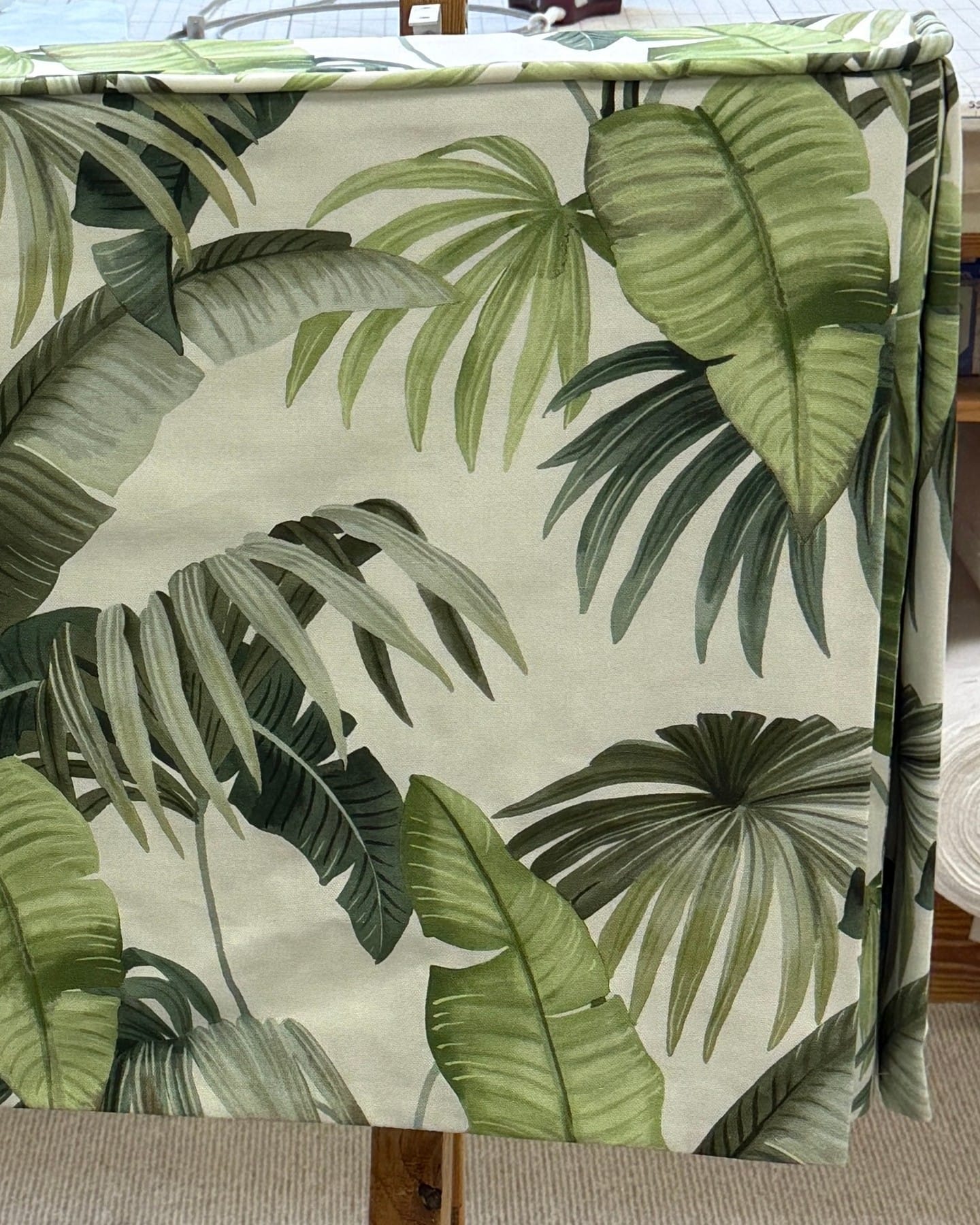 window with leaf-patterned curtains
