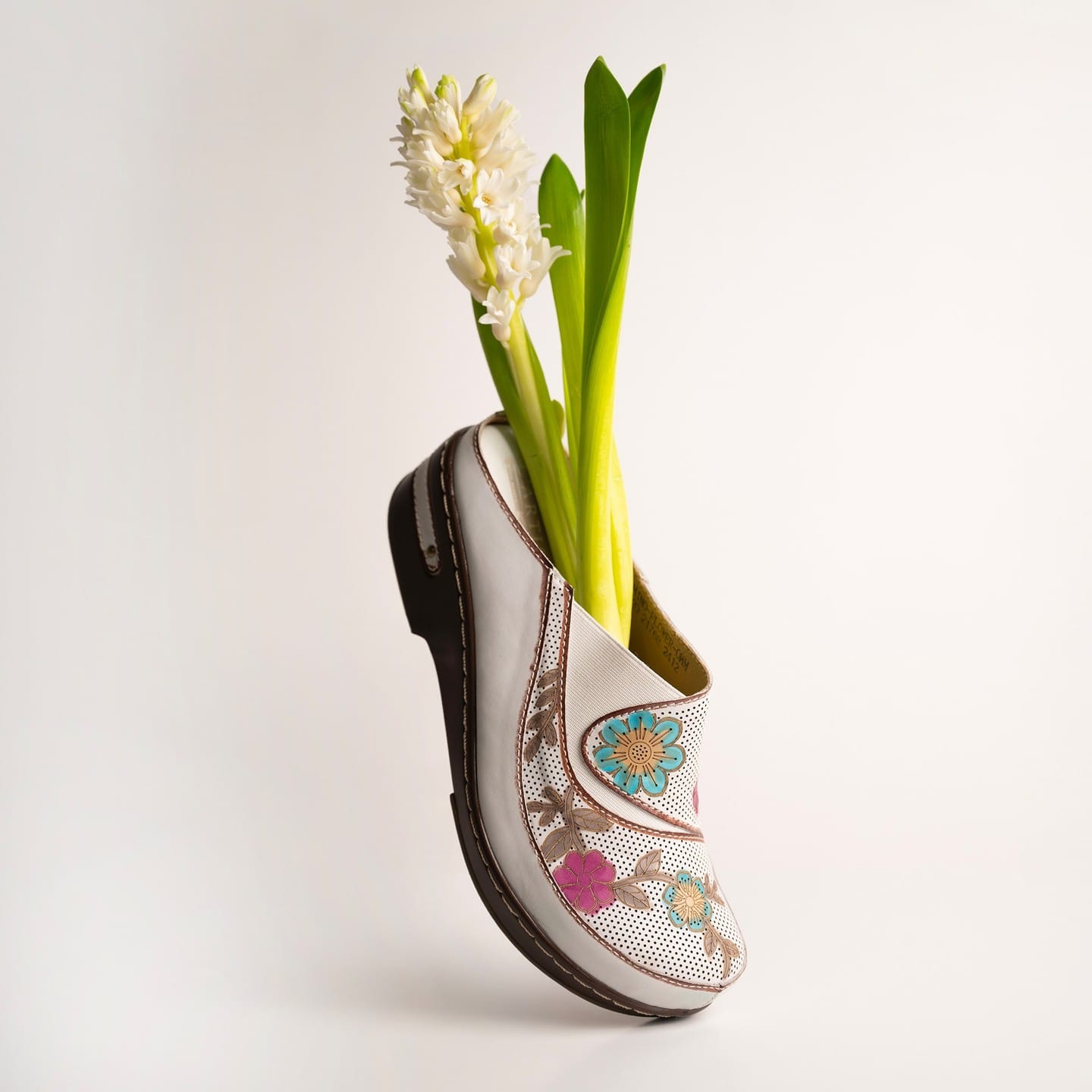 artistic wooden shoe plant holder with abstract design