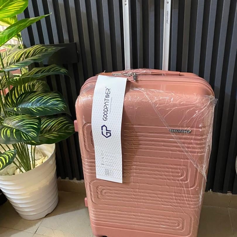 brightly painted suitcase with colorful flowers