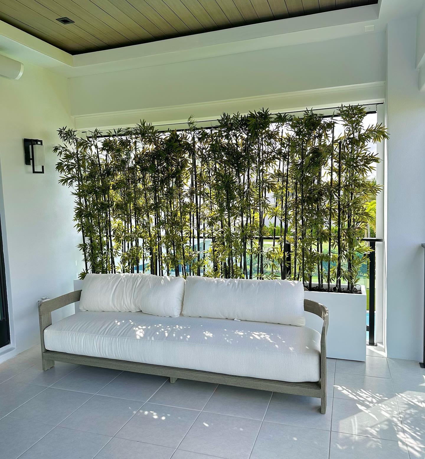 bamboo room screen with hanging plants