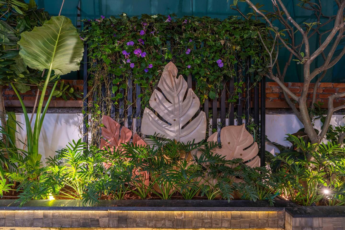 metal sculptural leaf on wall