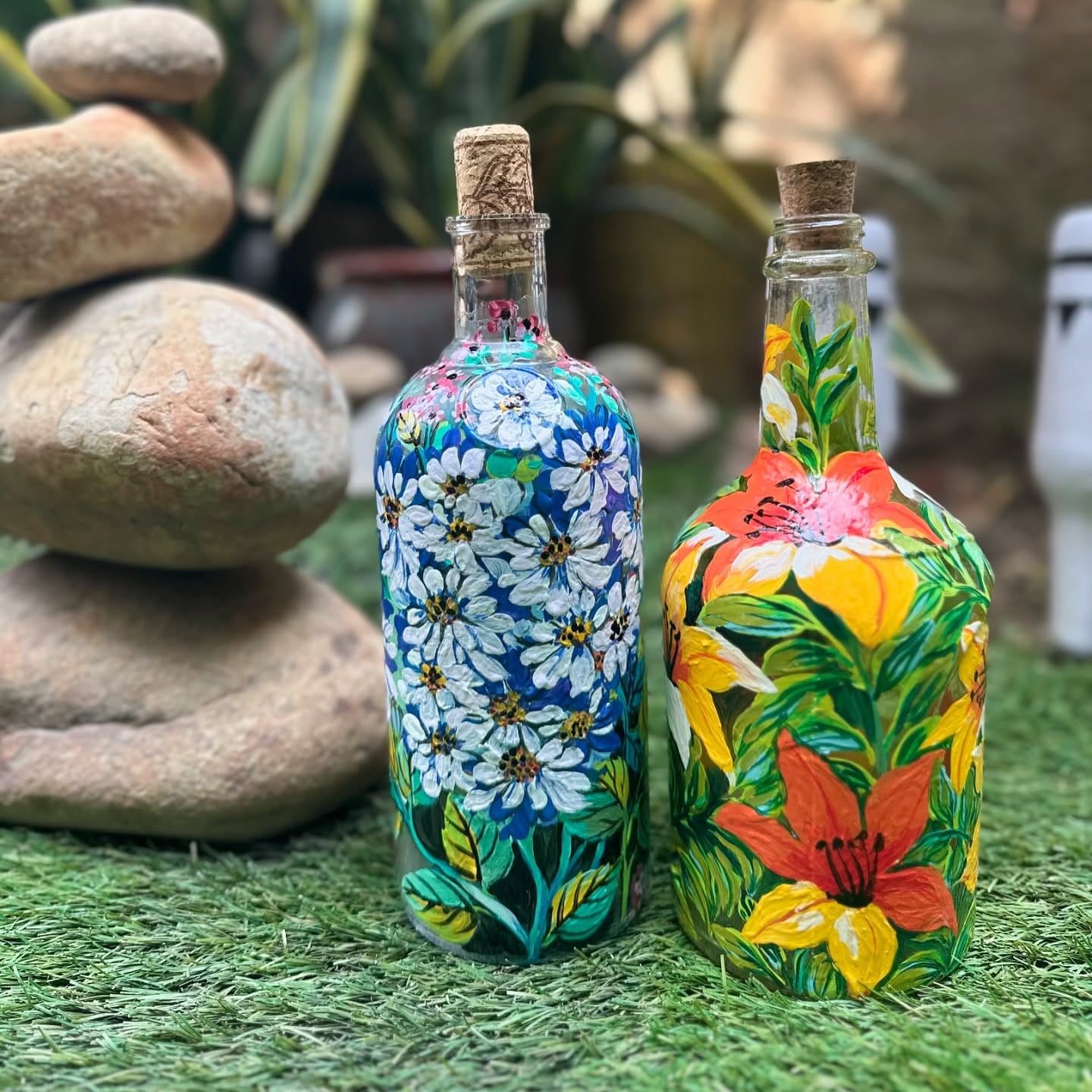 brightly painted wine bottle planters