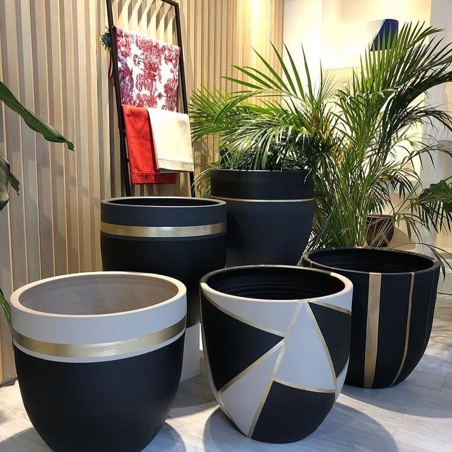 various-sized pots on a shelf