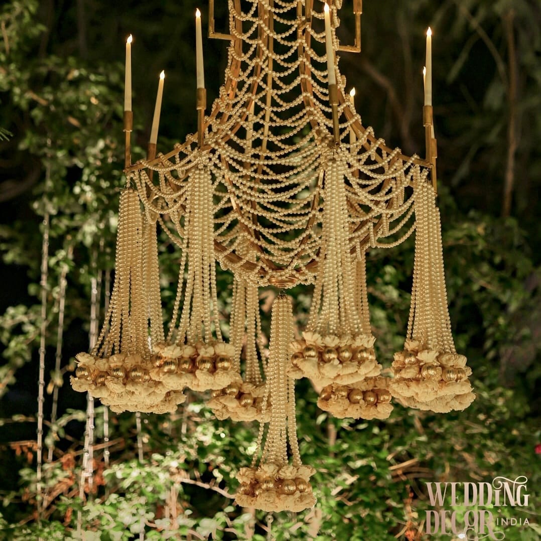 brass vintage chandelier with hanging ferns