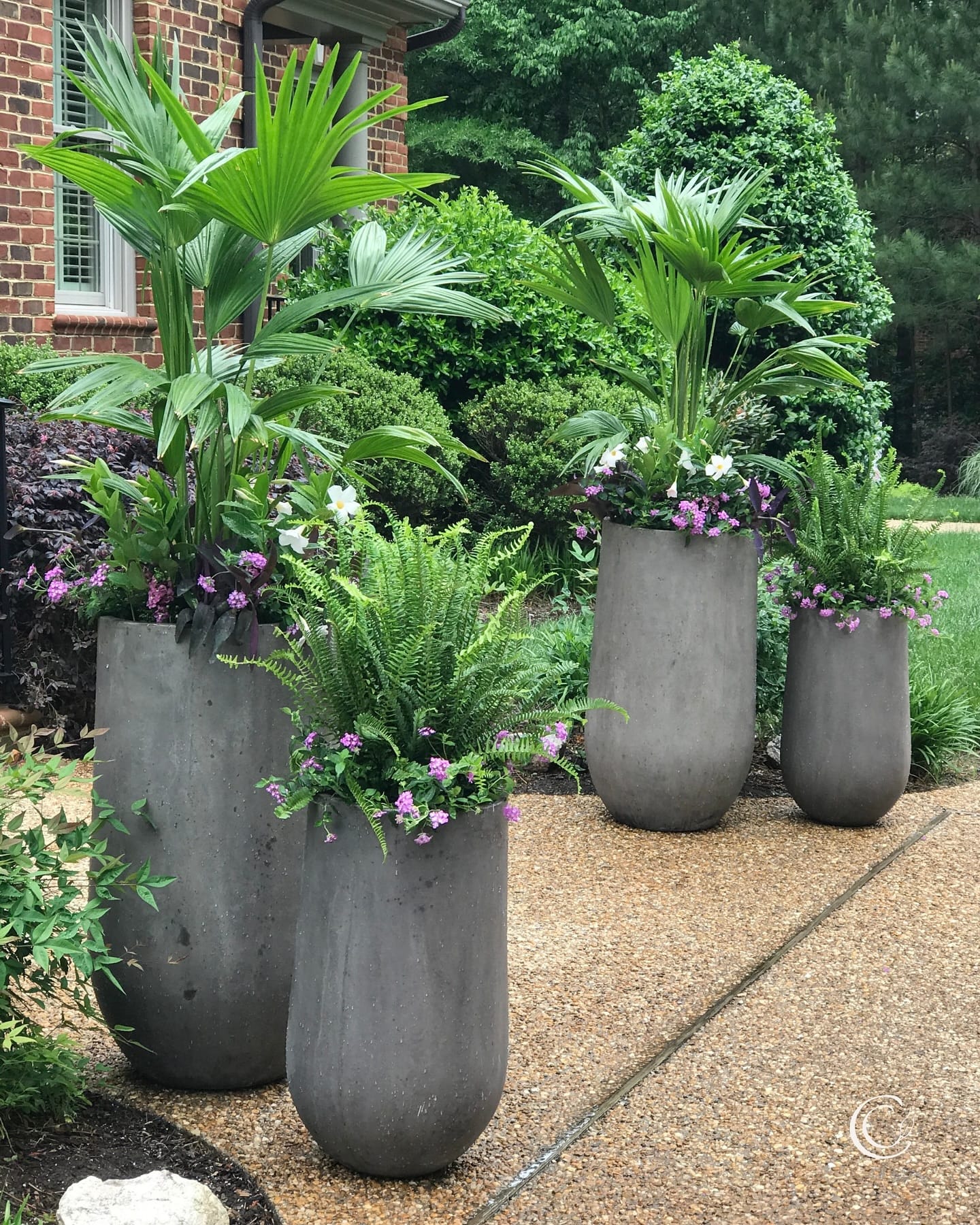 eco-friendly plants in cast iron urn