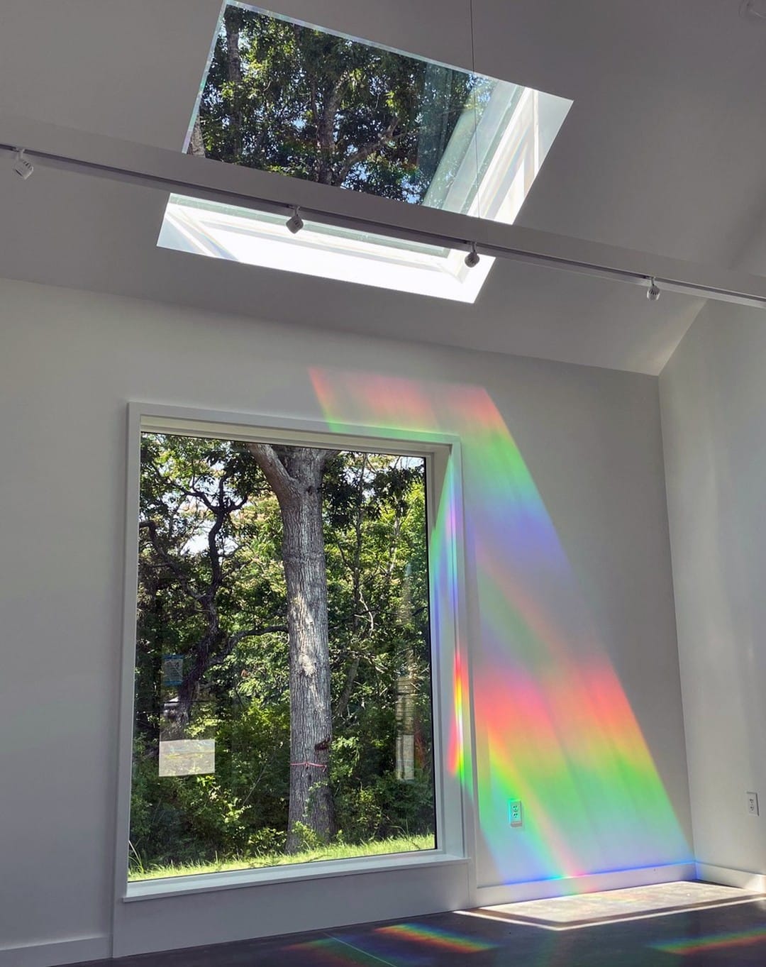 hands installing a window prism