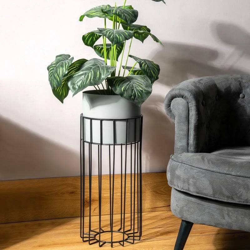 handcrafted metal vessel with bonsai