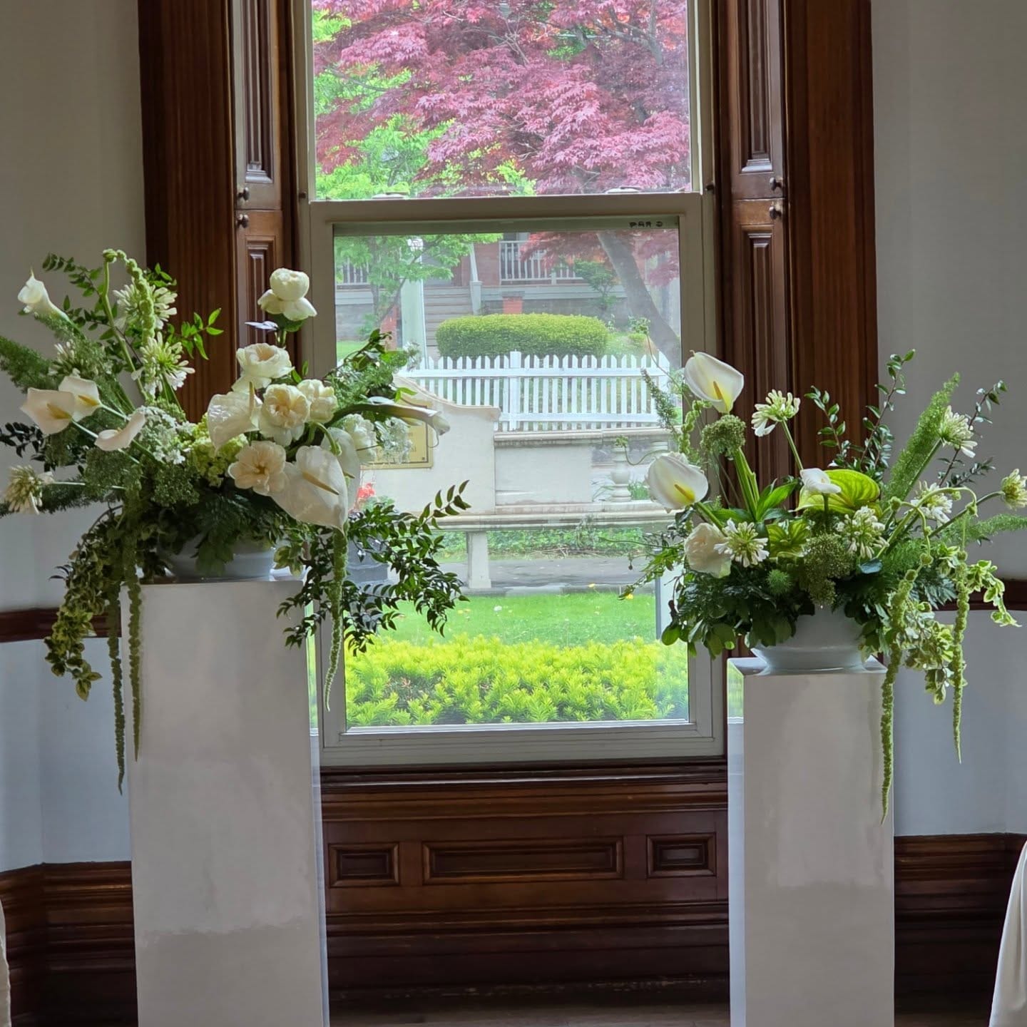 symmetrical plant arrangement in bay window