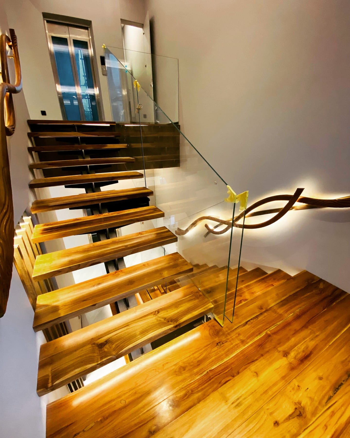 modern staircase with dramatic uplighting