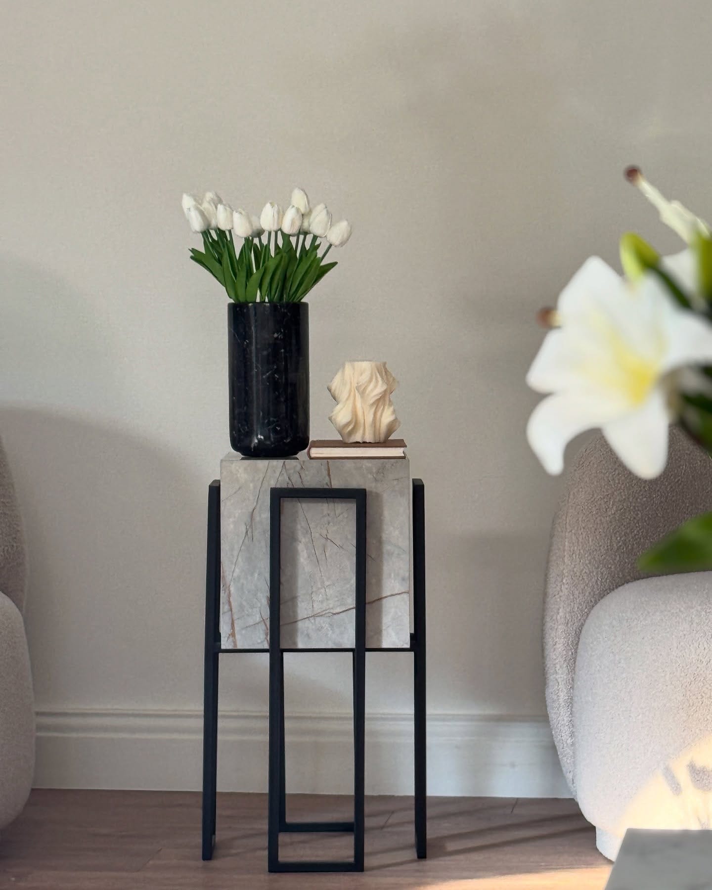 matching marble-look planters on bookshelf