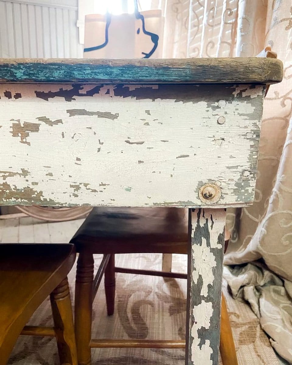 Reclaimed wood dining table with mismatched chairs