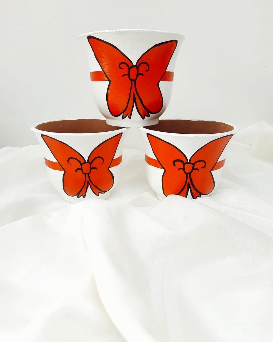 chives in small clay pots