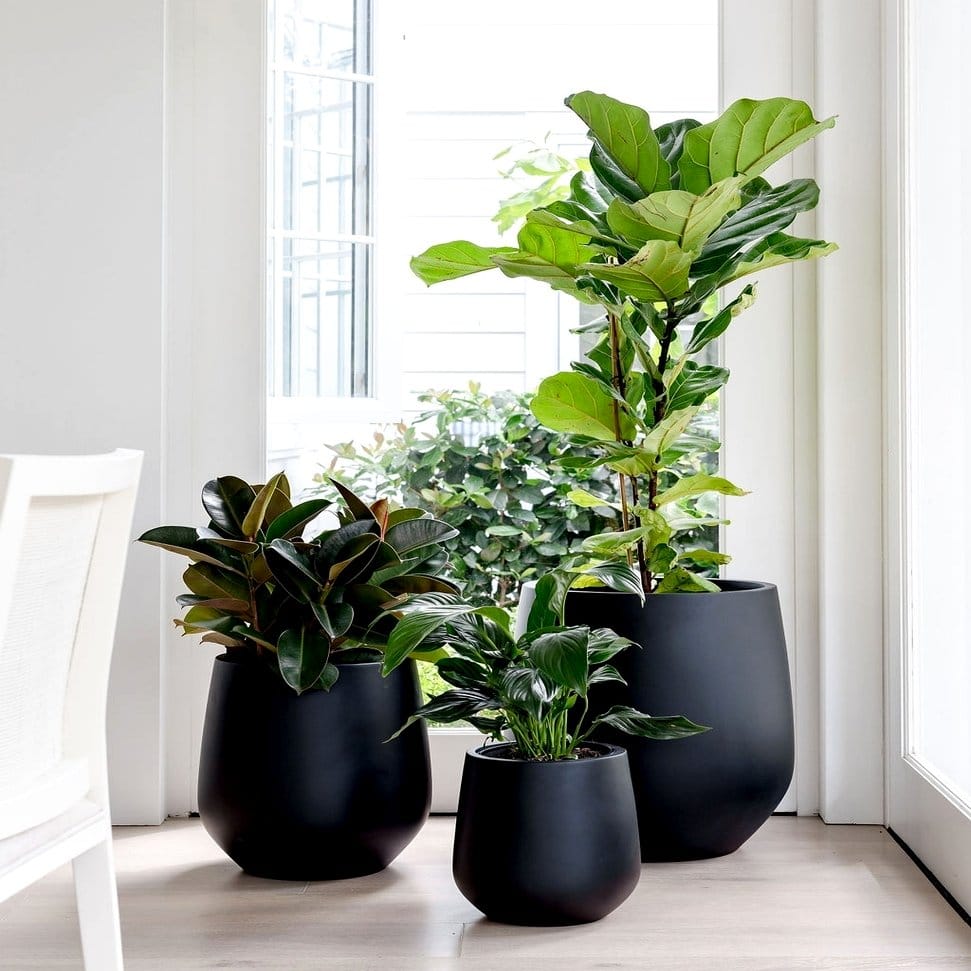 Stylish patio bench with planter armrests