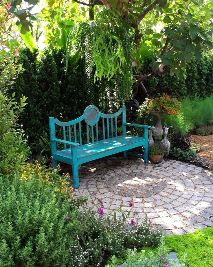 Hollowed log bench with colorful blooms