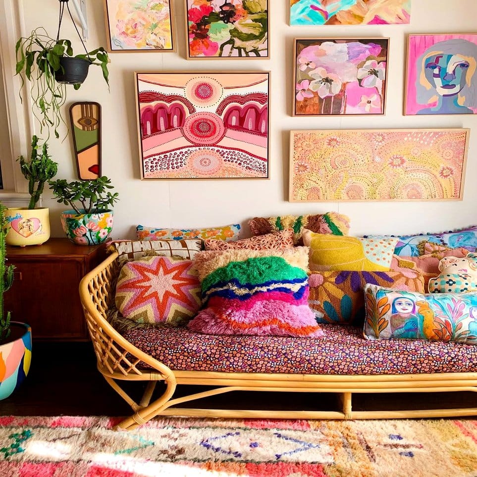 Rattan shelf with eclectic art and small plants