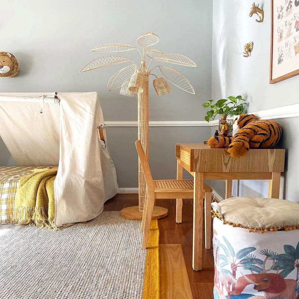 Colorful rattan shelf with child-friendly plants and books