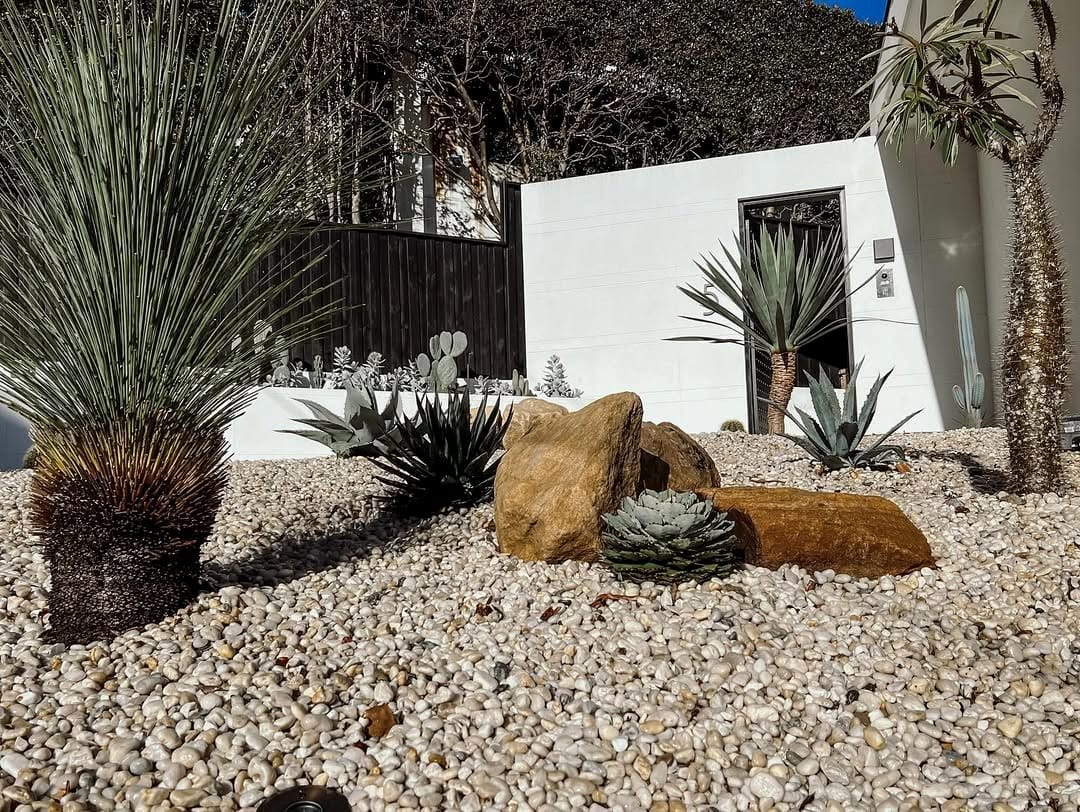 Balanced rock garden with succulents and pebbles