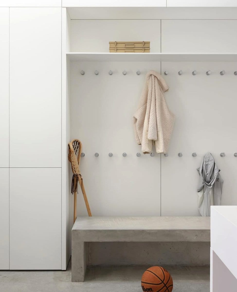 Organized minimalist mudroom with hooks and baskets